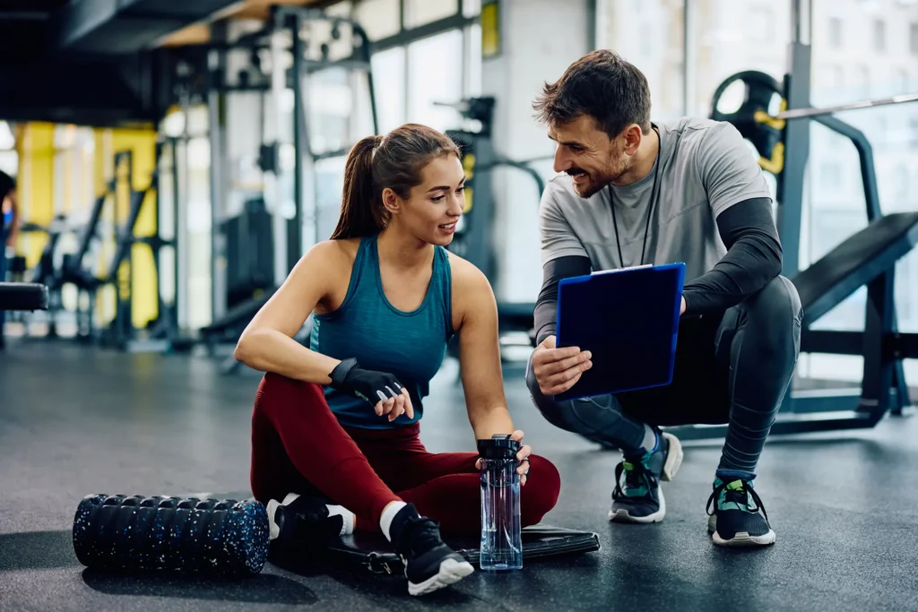 Customer at gym being helped