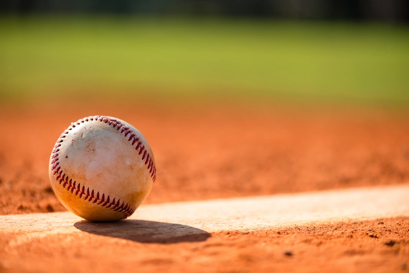 Closeup image of a baseball on the field