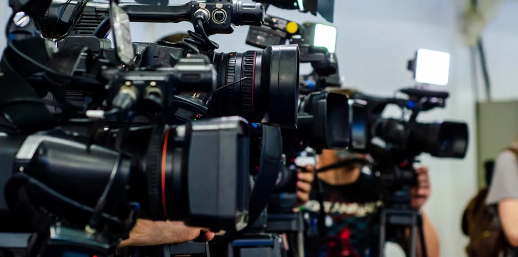 Public media facing funding threats. Image of up-close shots of video recorders.